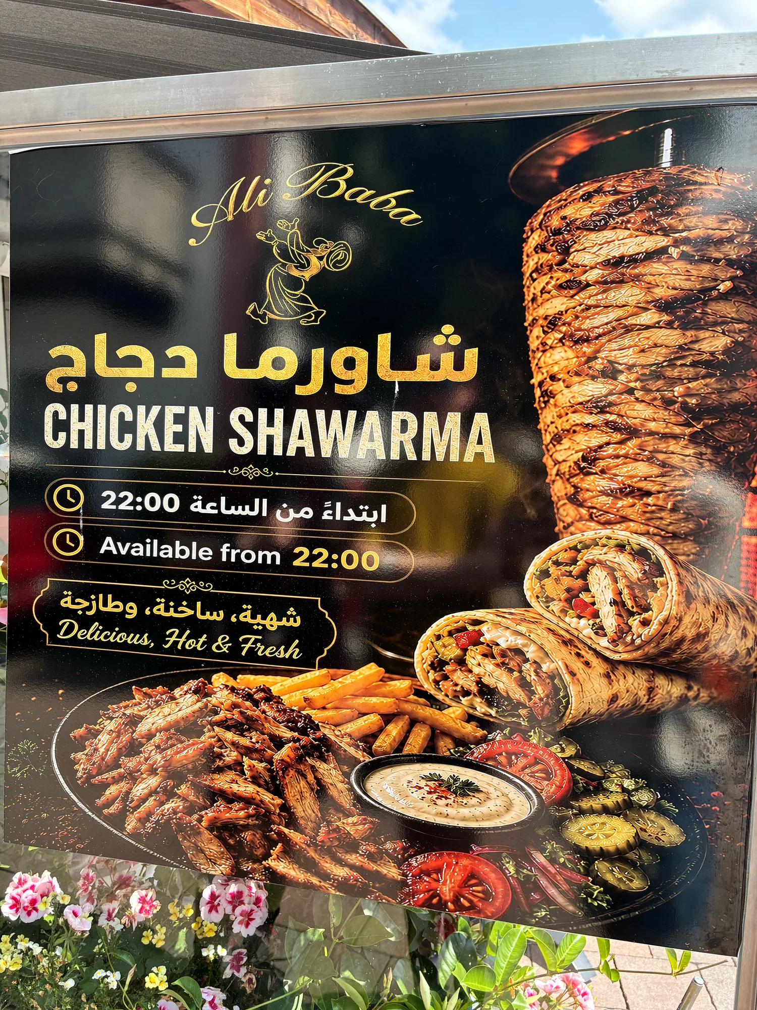 A chicken shawarma restaurant sign with AI-generated food photography